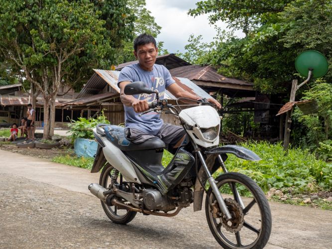 To get around his community in Bagong Kahayag, Lakewood, Zamboanga del Sur, Rodello Garillo uses his hand to start and stop his motorcycle.