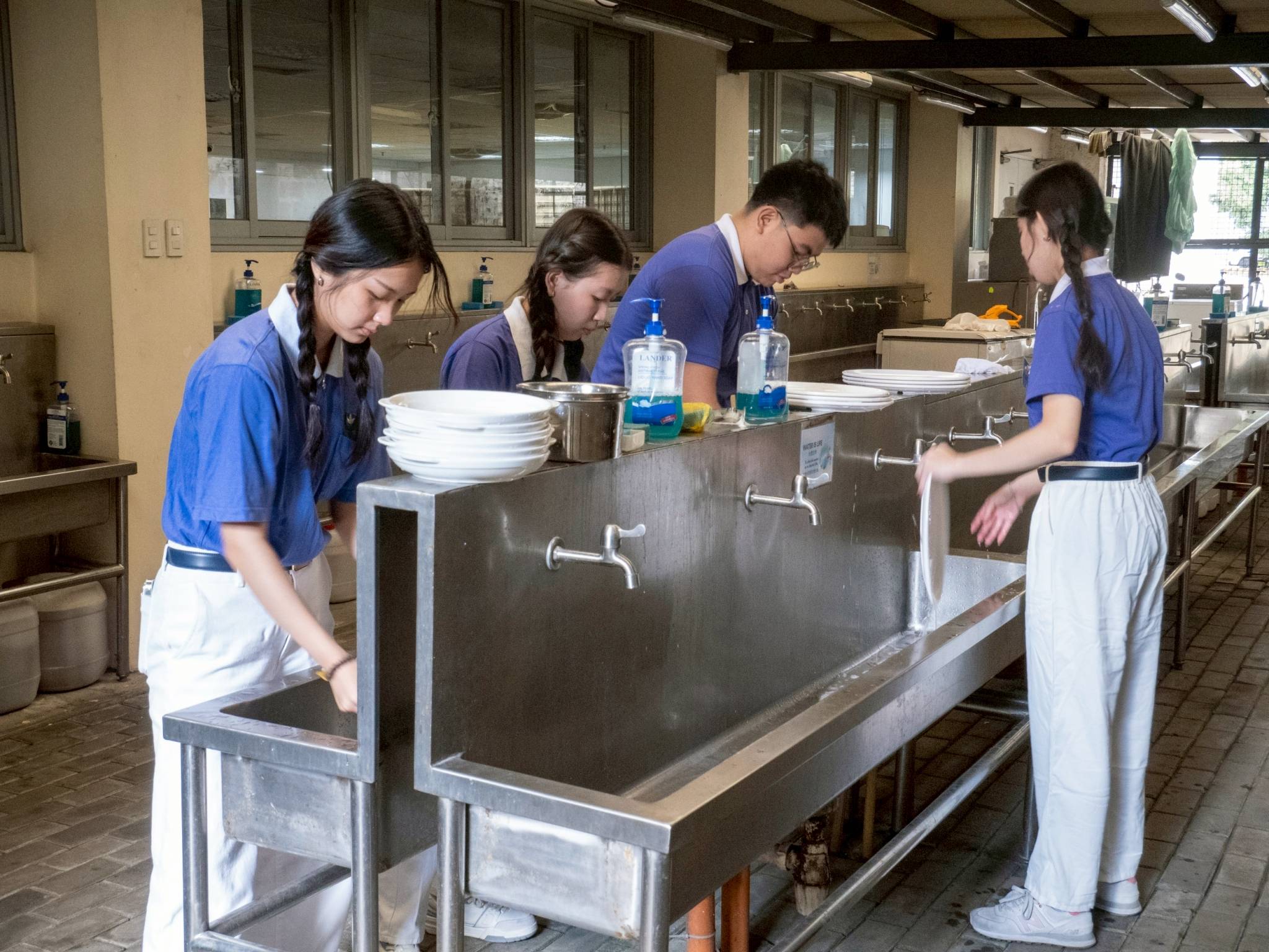 TCY volunteers were hands-on in various aspects of the three-day camp, including dishwashing duties. 