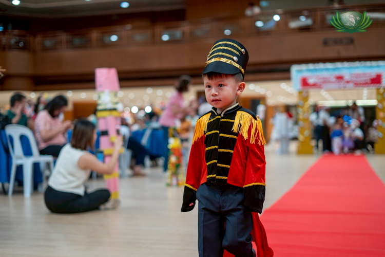 Nursery students dressed in Nutcracker costumes paraded on the red carpet with confidence.