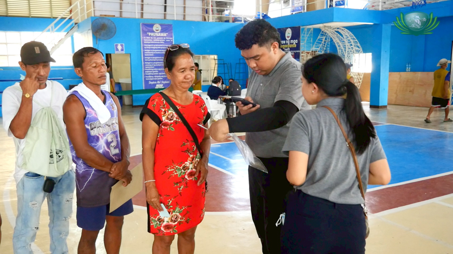 Beneficiary Severina Musni (in red) celebrated her 60th birthday by receiving relief, grateful for the donation even without a birthday celebration.