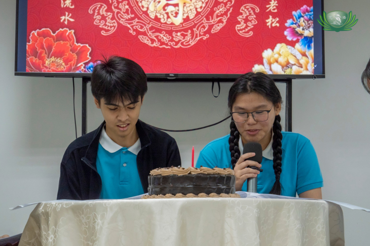 Shyeanne Mae Cheng (right) takes part in a script-reading activity about birthday celebrations.