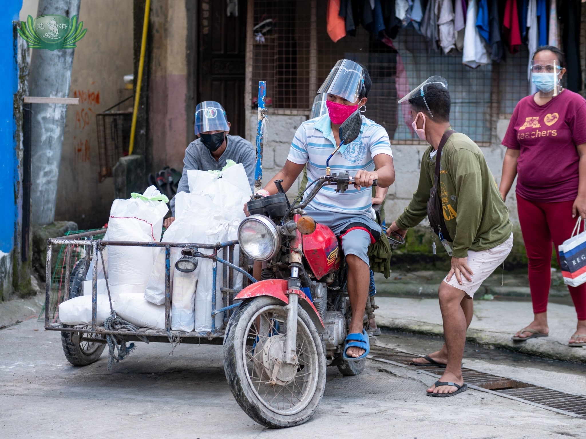 Scavengers transport their relief goods in a sidecar. 