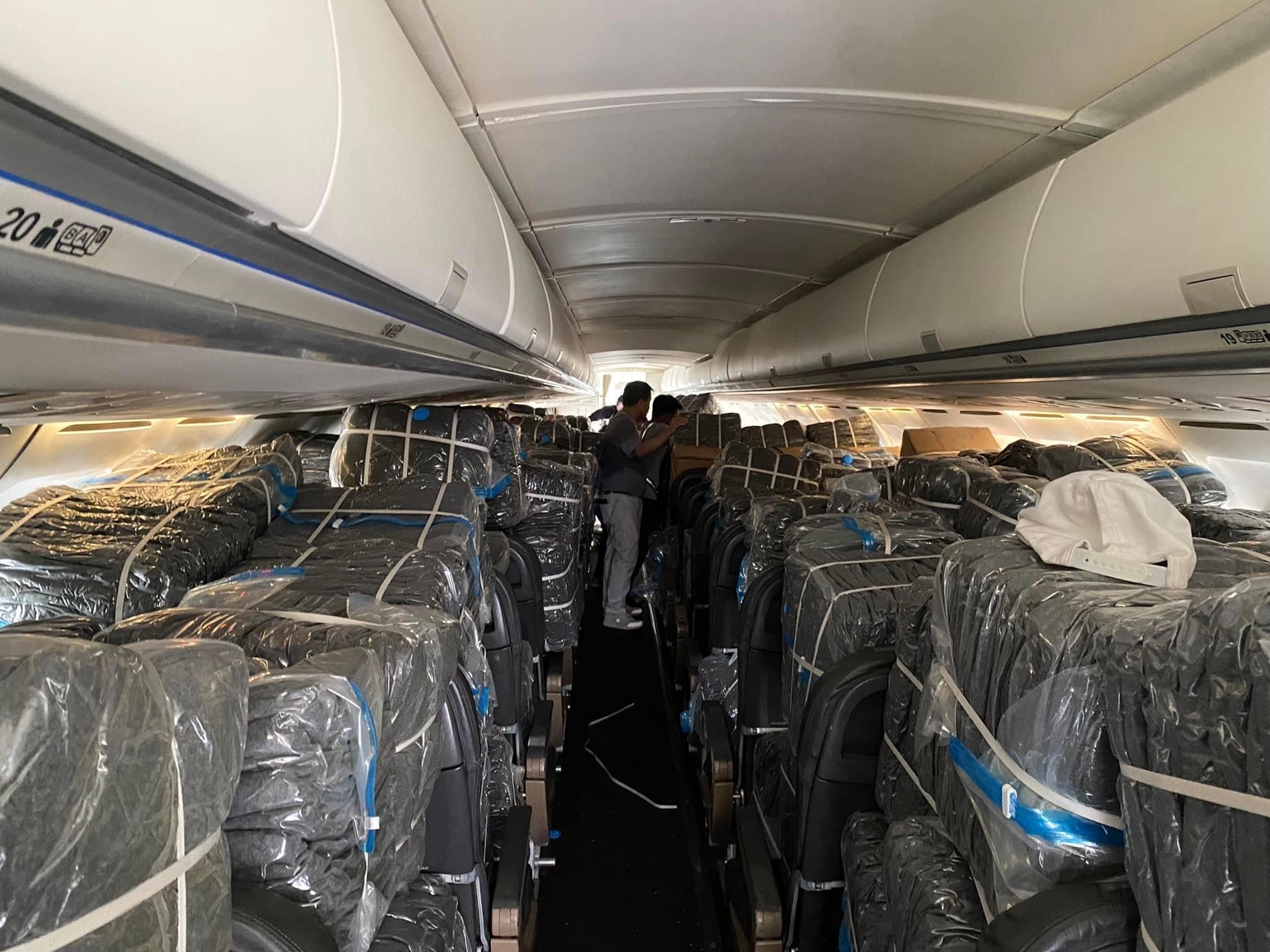 Packed blankets are the “passengers” of this charter flight en route to Tacloban.