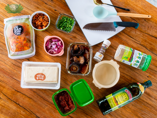 Ingredients of the vegan Kimchi-jjigae: vegan Kimchi, firm tofu, Shiitake Mushrooms, Ssamjang (Korean barbecue sauce), mushroom powder, spring and red onions, cooking oil, water, and Korean seasoning. 【Photo by Daniel Lazar】