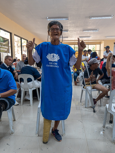 Seventy-five-year-old Bienvenido Espelita posed with his self-made prosthesis.