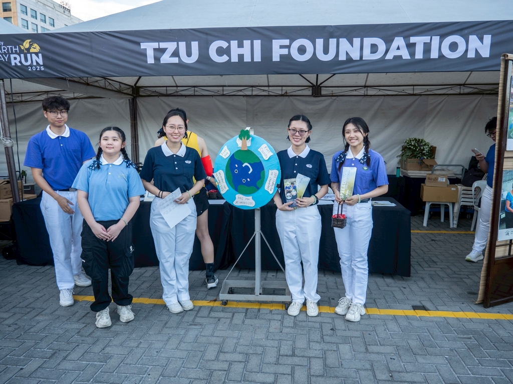 At the Tzu Chi Foundation booth, Tzu Chi Youth promote the foundation’s missions and its upcoming Charity Run for Education. 