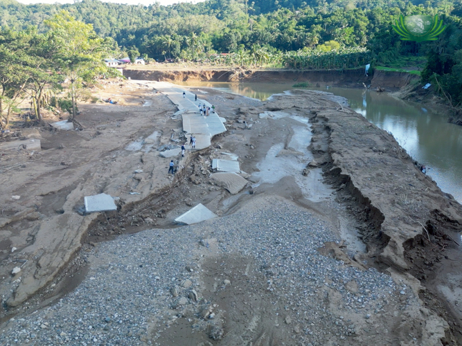 In Cabadiangan, Compostela, Cebu, what used to be a residential area on the left side is now an empty muddied site with the roads destroyed after the flood.