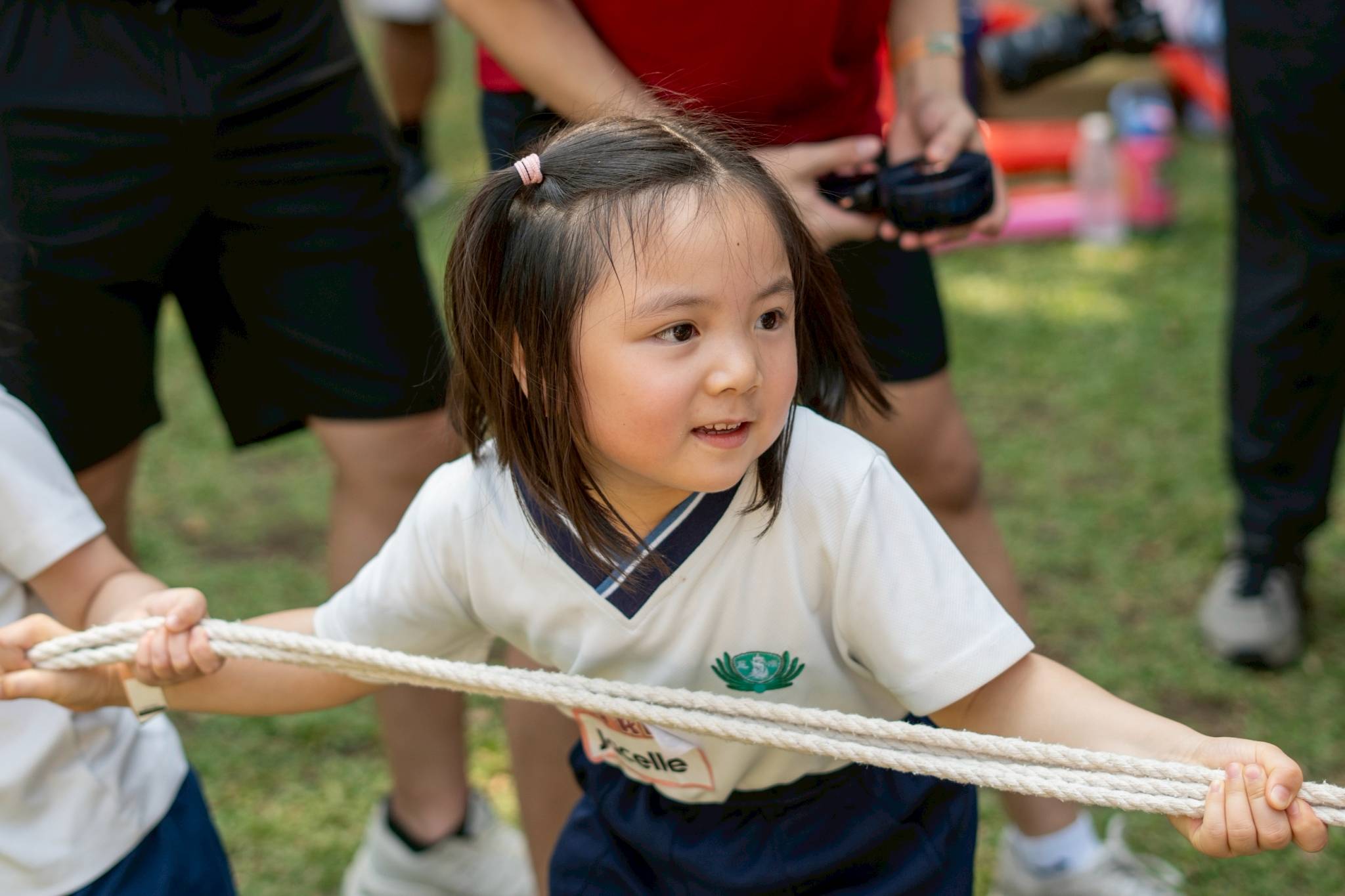With the support of their parents and guardians, preschool students gave their all in their tug-of-war game.