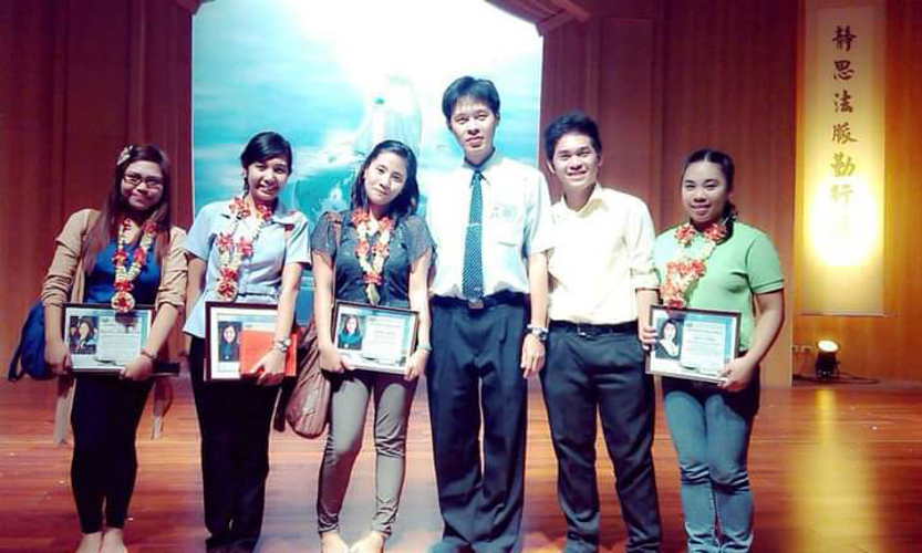 Mary Rosedy “Dhy” Detasyon Antigua (second from left) at a recognition program for Tzu Chi scholars held at the Jing Si Auditorium