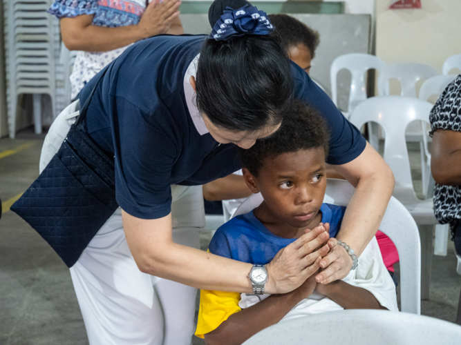 Twenty-one Aetas endured a two-hour trip from their community in Sitio Target, Barangay Sapang Bato, to Tzu Chi's dental mission in Mitchell Avenue, Balibago, Angeles, to avail of free dental treatments.
