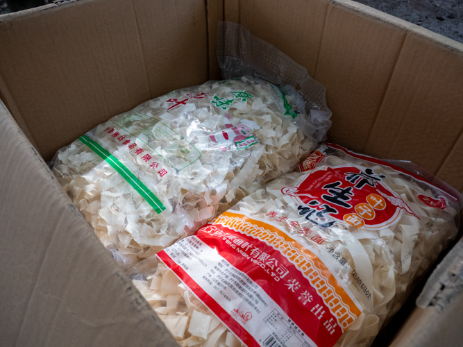 Donation also includes ten huge packs of noodles. 【Photo by Matt Serrano】