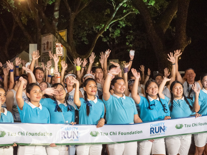 Tzu Chi scholars kept runners at the starting line of every race category.