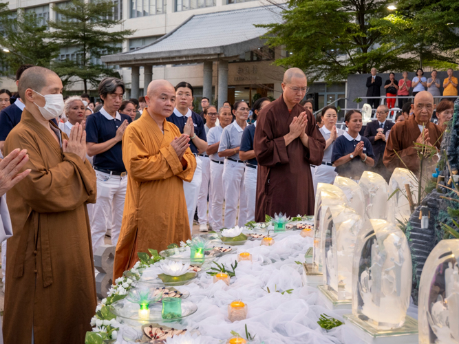 Dharma master take the lead in the Buddha Bathing Ceremony.