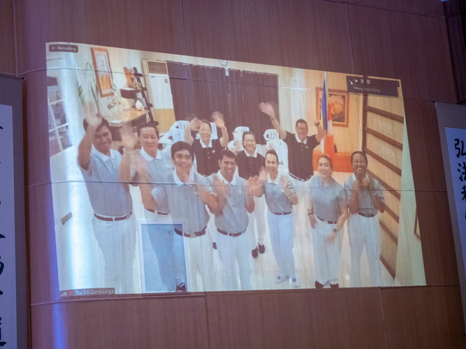 Tzu Chi Zamboanga commissioners and volunteers in training cheer following a happy Moving Up ceremony. 【Photo by Matt Serrano】