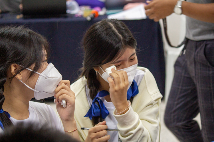 A participant wipes her tears after a touching session on filial piety. 【Photo by Marella Saldonido】