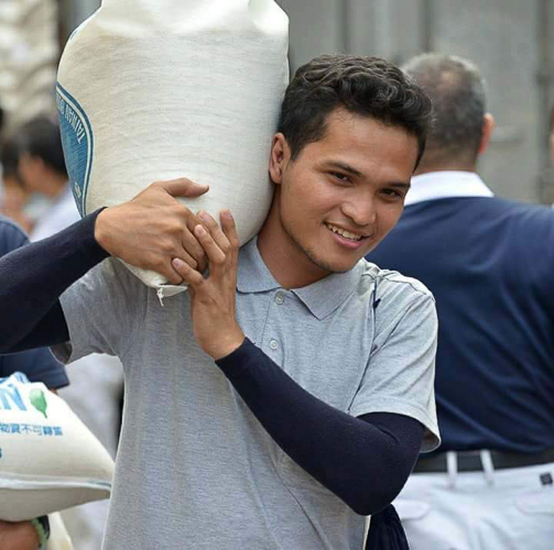 Johniel Tuando participates in a rice relief operation.
