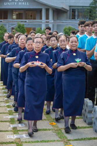 The ceremony starts with senior volunteers leading the incense praise.