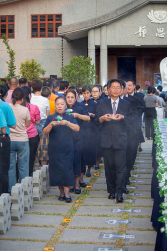 The ceremony starts with senior volunteers leading the incense praise.