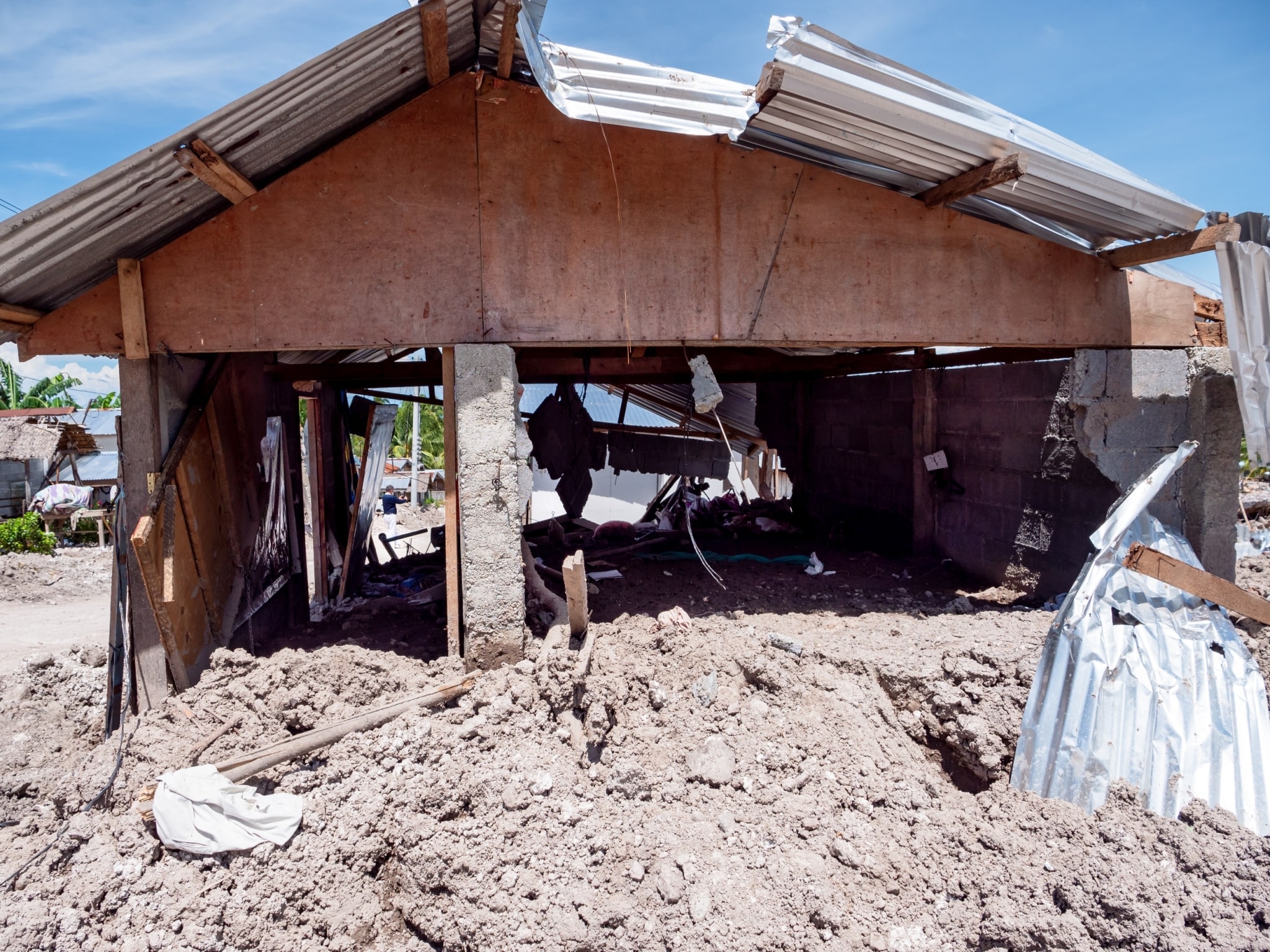 Houses were wiped out by mud and boulders in a community beside a mountain in Brgy. Kusiong, Datu Odin Sinsuat, Maguindanao del Norte. 【Photo by Daniel Lazar】