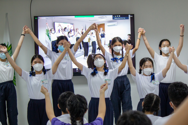 Youth campers perform a sign language number. 【Photo by Marella Saldonido】