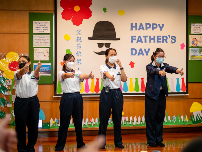 Preschool teachers lead the opening dance energizer during the preschool’s Father’s Day celebration. 【Photo by Daniel Lazar】