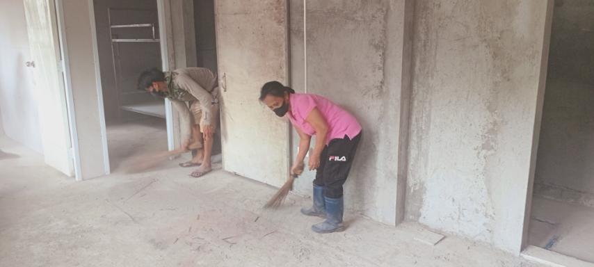 Dust and cement particles are washed and swept out of buildings.